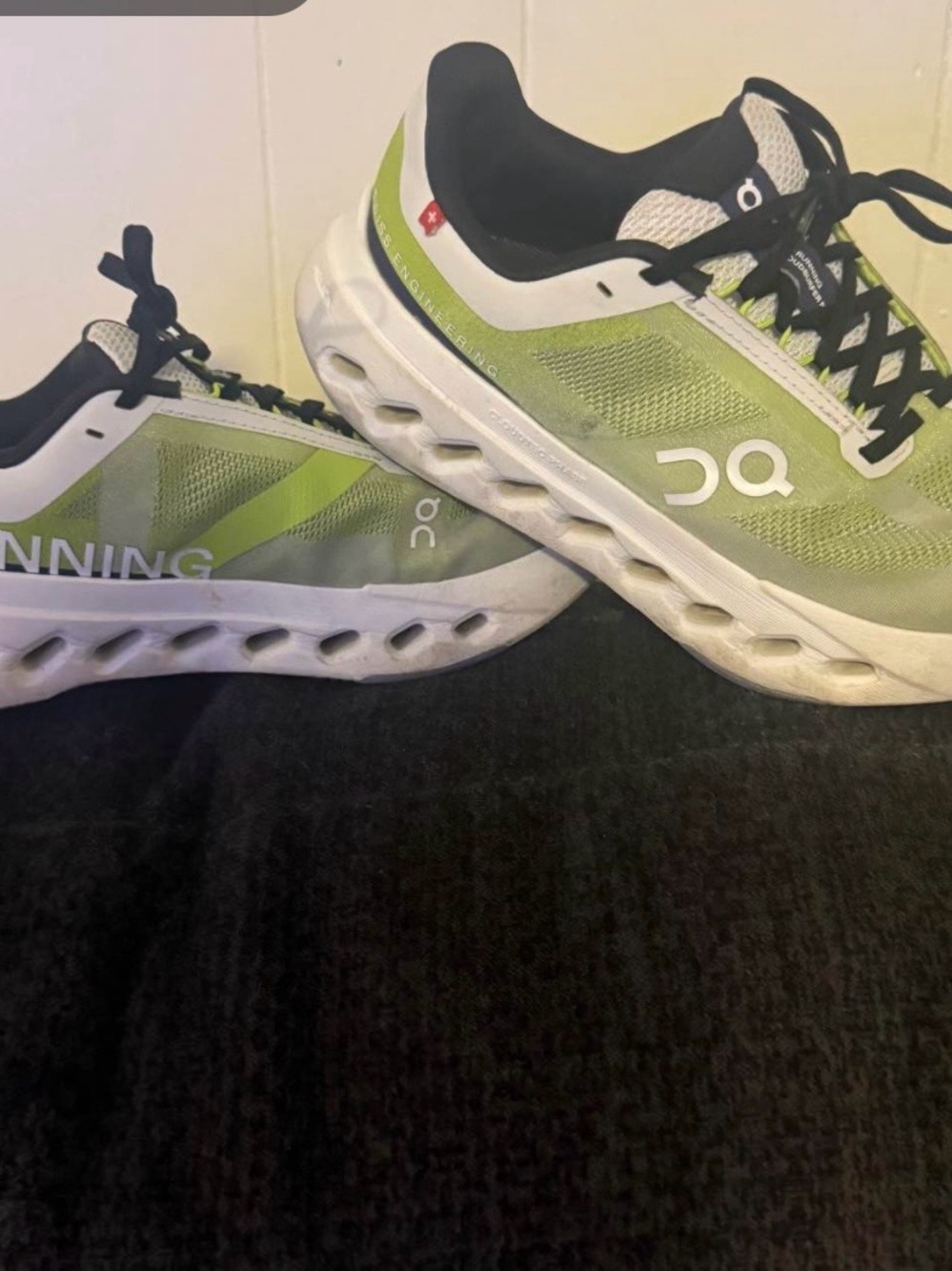 On Running Light Green and White women’s Athletic Running Shoes